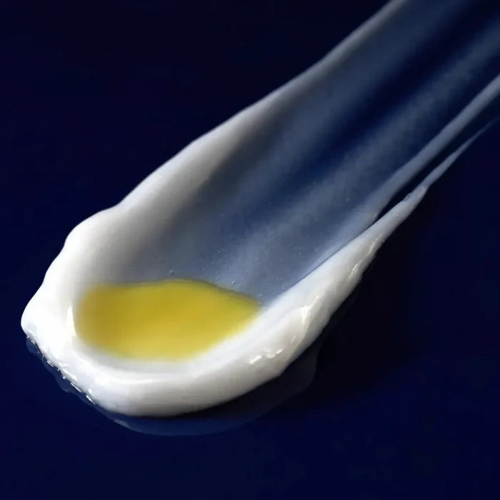 Dual-phase retinal eye serum texture with white cream and yellow oil layer