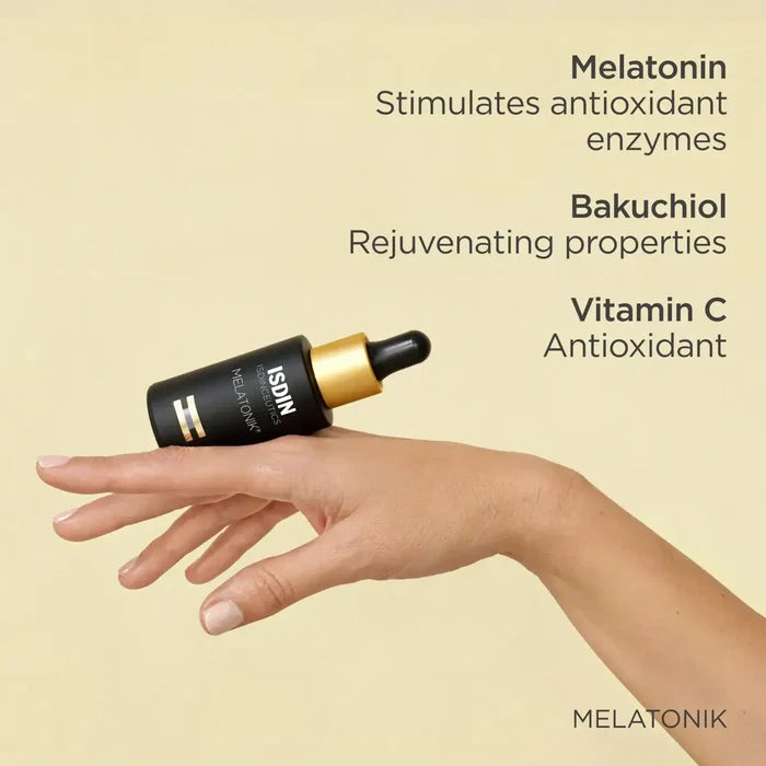 ISDIN Melatonik serum bottle on hand with melatonin, bakuchiol and vitamin C benefits