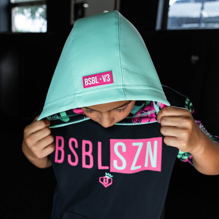 Youth model wearing black short sleeve hoodie with "King Of JUCO BSBL-SZN V3" design