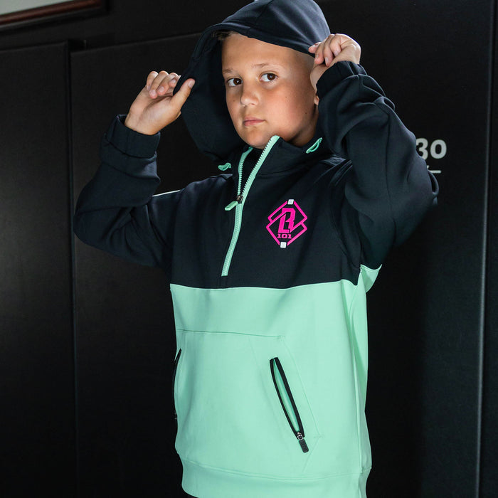 Youth model wearing teal quarter zip hoodie with "King Of JUCO" design