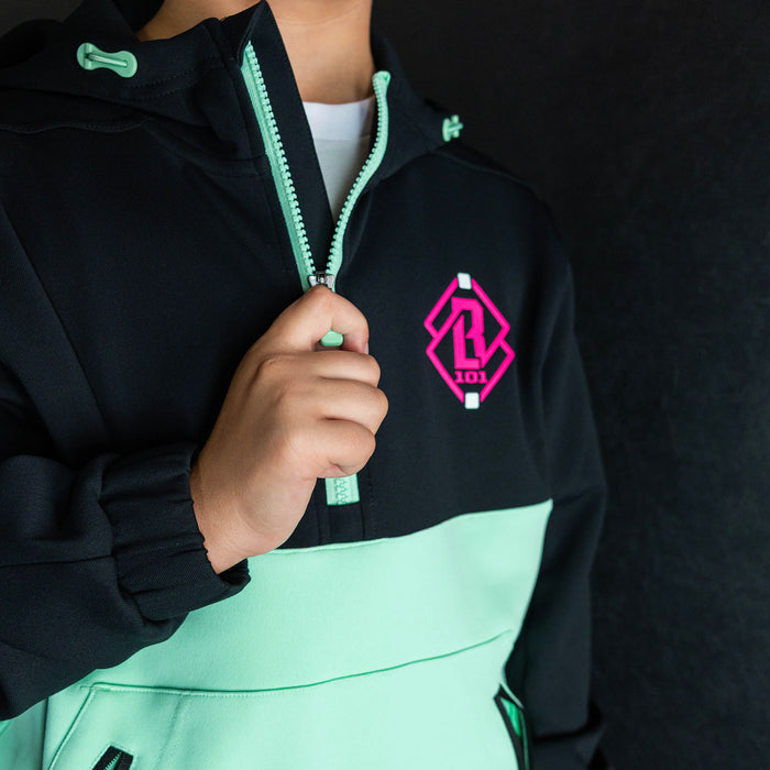 Youth model wearing teal quarter zip hoodie with "King Of JUCO" design