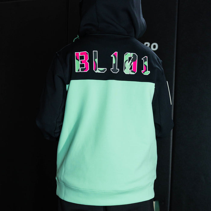 Youth model wearing teal quarter zip hoodie with "King Of JUCO" design