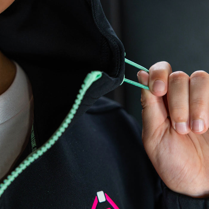 Youth model wearing teal quarter zip hoodie with "King Of JUCO" design