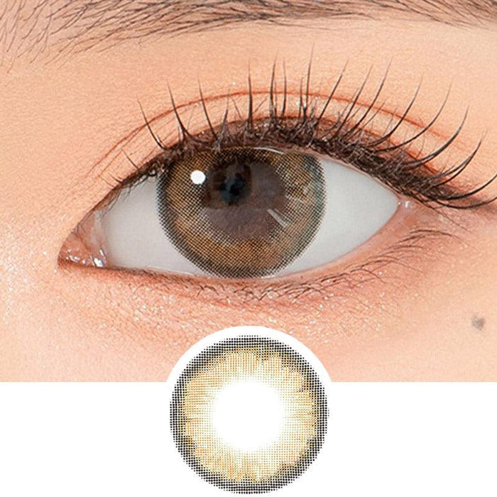 Close-up shot of a model's eye wearing Lensrang Hello Brown color contacts with prescription, paired with K-beauty-inspired eye makeup, showing the brightening and enlarging effect of the circle contact lens on dark brown eyes, above a cutout of the contact lens pattern with limbal ring on a white background.