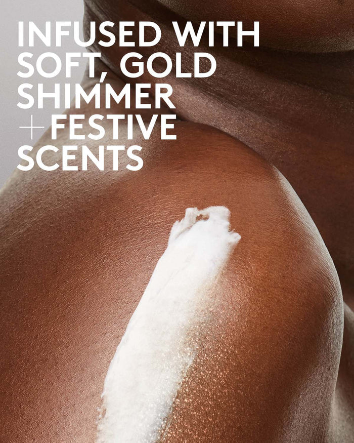 Infused with soft, gold shimmer and festive scents. Copy displayed over a model applying Butta Drop Whipped Oil Body Cream.