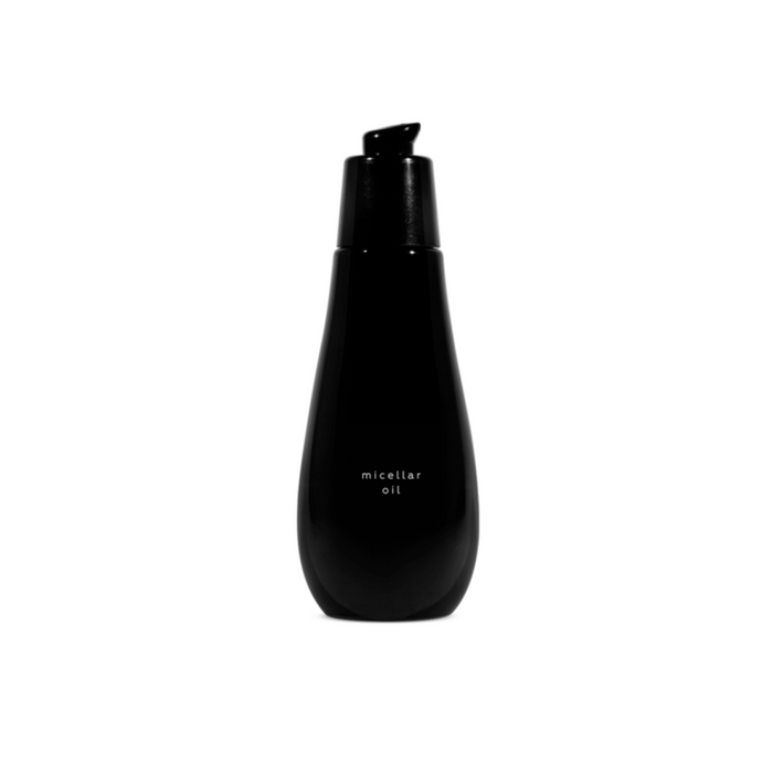 A black bottle with a pump dispenser labeled 'micellar oil'.