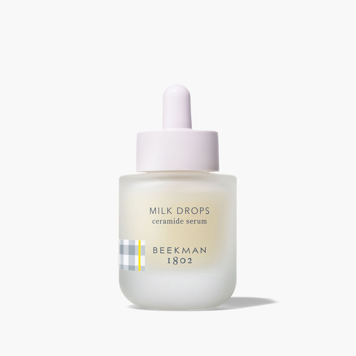 Milk Drops Ceramide Serum on grey background