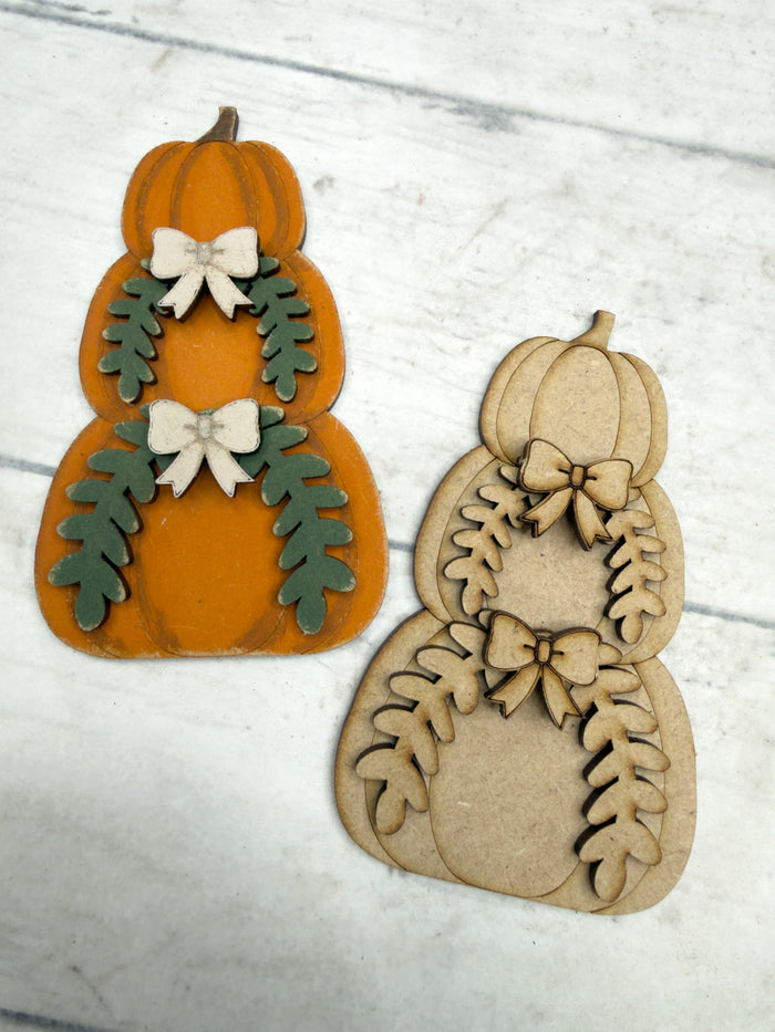 Paint-your-own stacked pumpkin craft kit featuring etched seasonal details