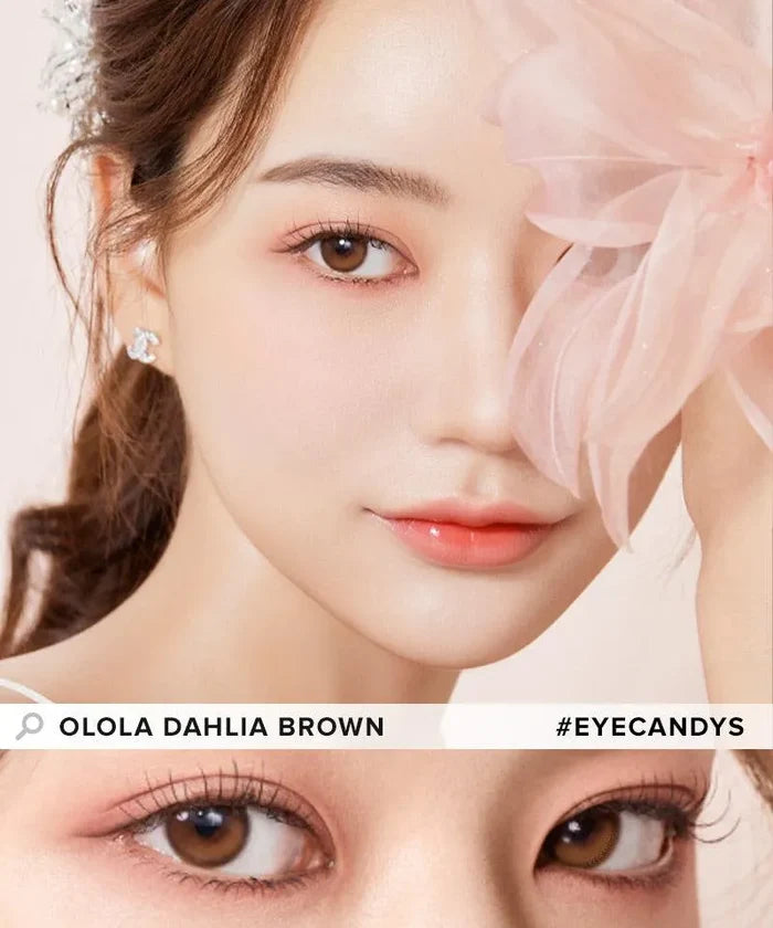 A woman with soft makeup and Olola Dahlia Brown contact lenses poses with a large pale pink flower covering one eye. A close-up shows her brown eyes. Text: “Olola Dahlia Brown by Olola #eyecandys.”.