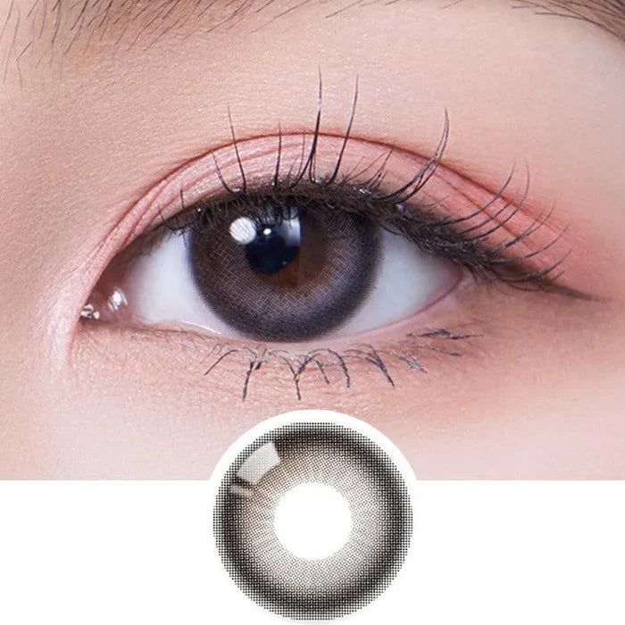 A close-up of a person’s brown eye with long lashes wearing Olola Daymood Grey contact lens by Olola for myopia; below is a separate image of the same lens.