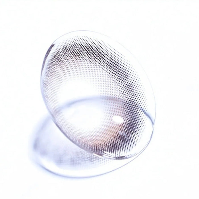 Macro shot of EyeCandys Olola Meow Koshort Grey colored contact lens, showcasing intricate lens pattern and subtle grey color.