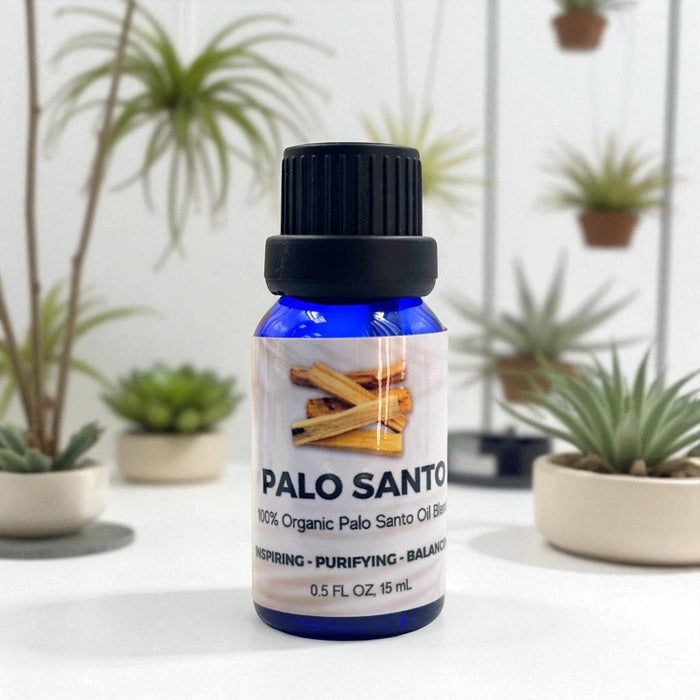 Bottle of Palo Santo oil blend with plants in the background