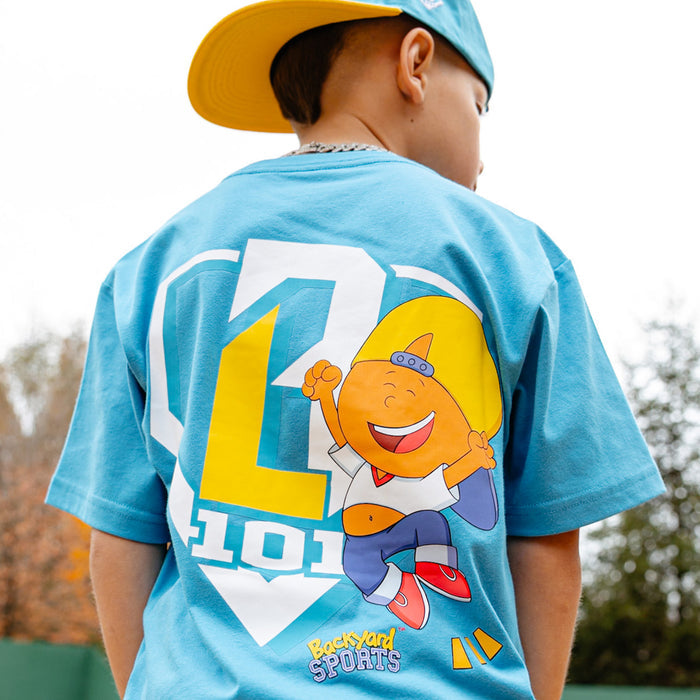Youth model wearing blue youth graphic tee with “Pablo Power” design