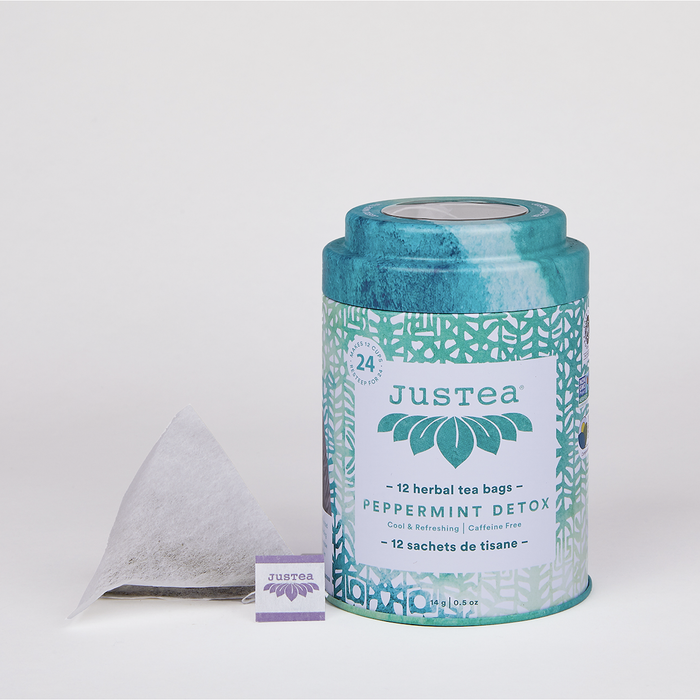 JusTea Peppermint Detox tea bag canister on a white background.
