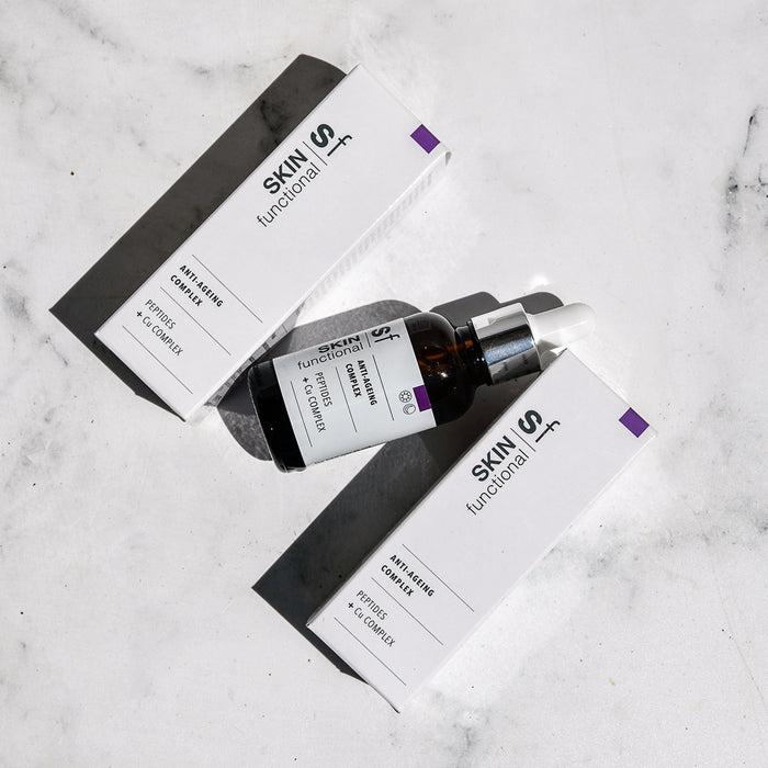 SKIN Functional anti-ageing complex treatment with details skincare product on a grey background