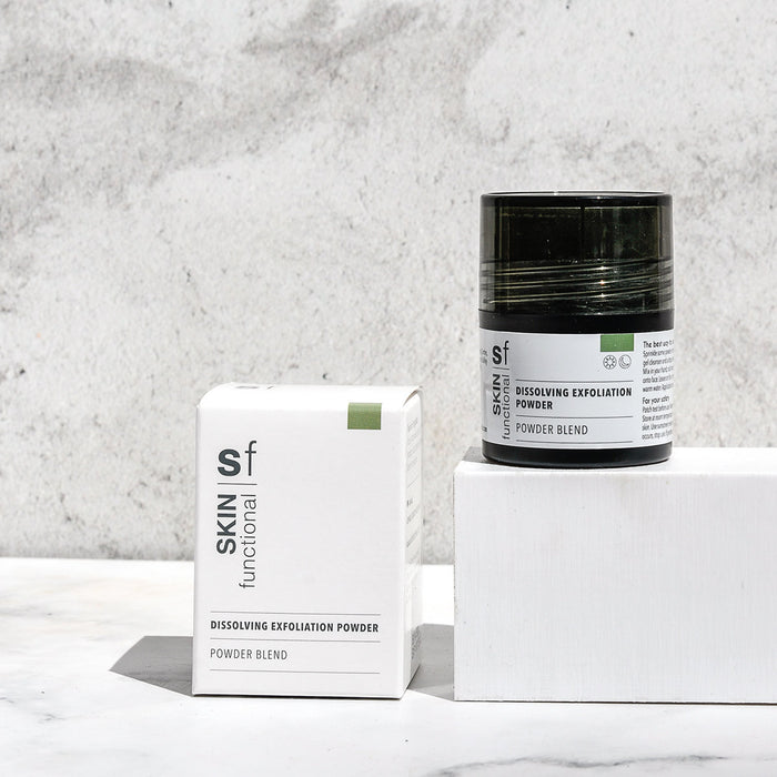 SKIN Functional dissolving exfoliation powder with details skincare product on a grey background