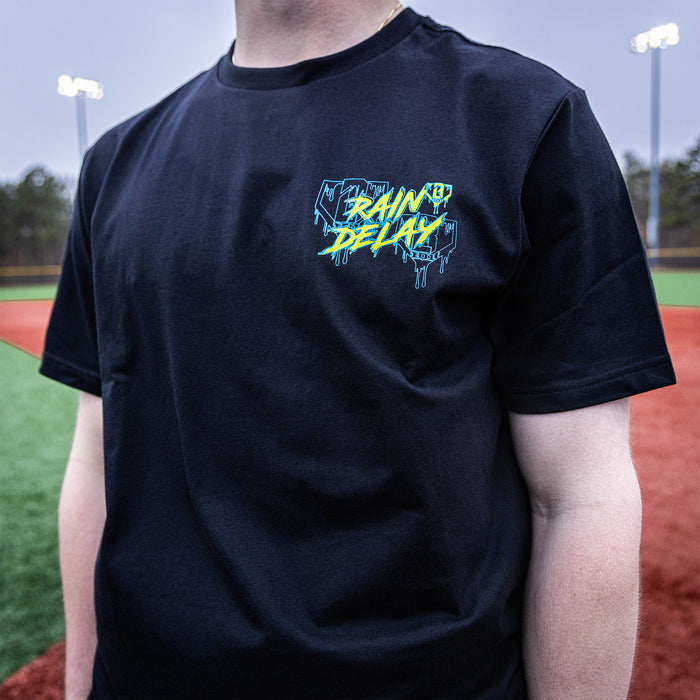 Youth model wearing black Rain Delay youth graphic tee