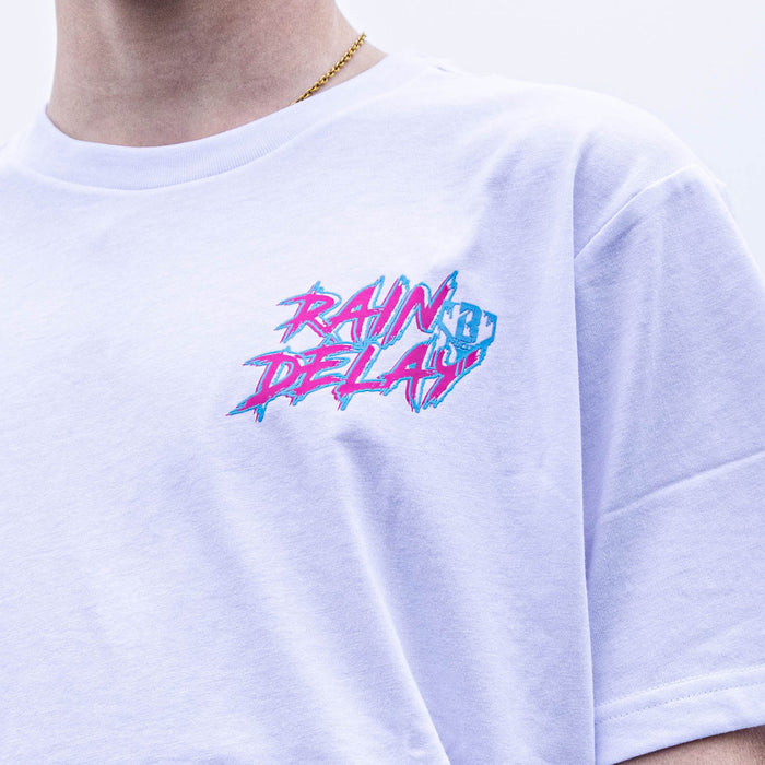 Youth model wearing white Rain Delay Cotton Candy youth graphic tee