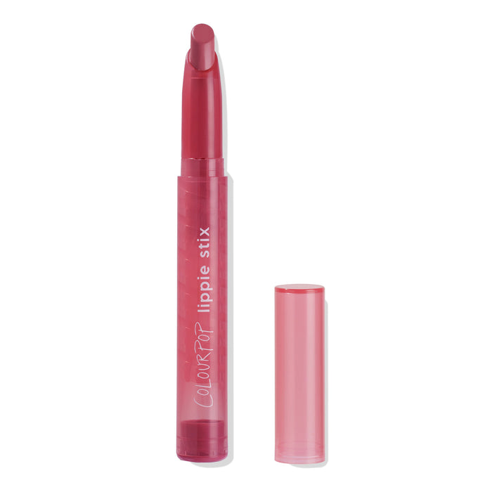 Songbird ColourPop Lippie Stix twists up to reveal a rosy pink, slanted lipstick bullet, displayed in a translucent pink tube with the cap off beside it on a white background.