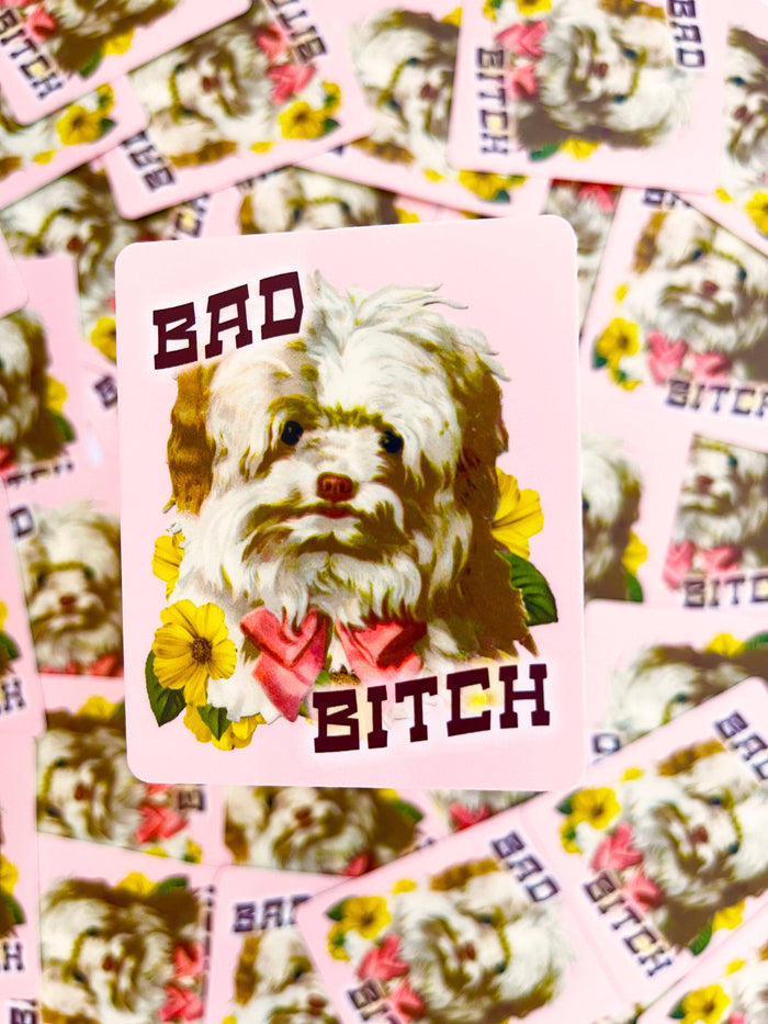 Pink puppy dog sticker with flowers featuring the "Bad Bitch" funny dog sticker design by The Coin Laundry.