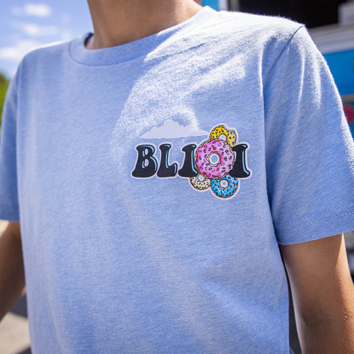Youth model wearing blue youth graphic tee with “Sugar Rush Donut” design