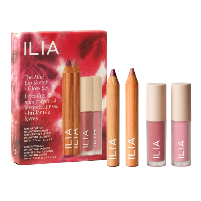 The ILIA "The Mini Lip Sketch + Gloss Set" product packaging standing upright next to its contents: two miniature wooden Lip Sketch Hydrating Crayons and two miniature Overglaze Hydrating Lip Gloss tubes in pink and mauve shades, all arranged neatly against a plain white background.