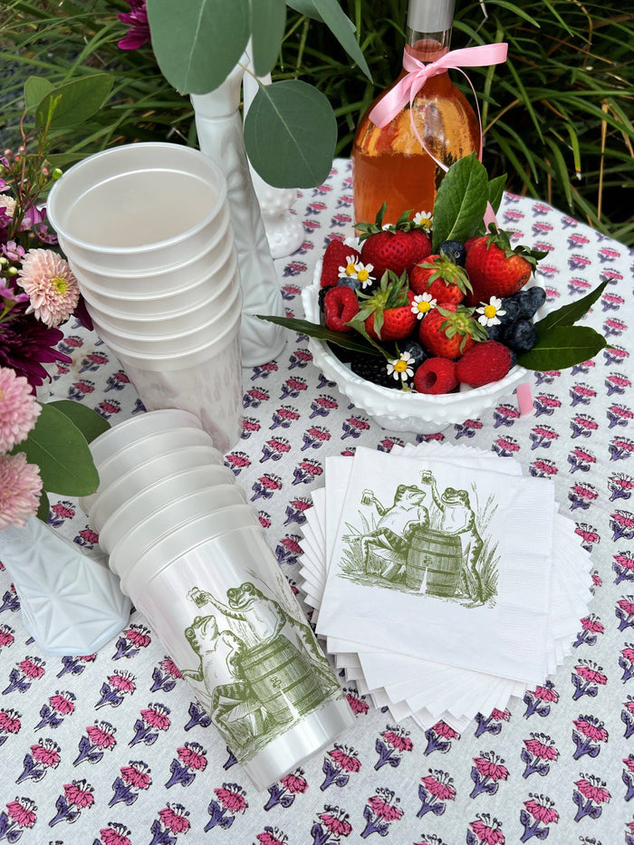 Set of Toasting Toads cocktail napkins by Alexa Pulitzer featuring colorful toad illustrations for parties and gatherings.