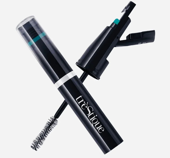Black tube of trèStiQue mascara with built-in eyelash curler on white background